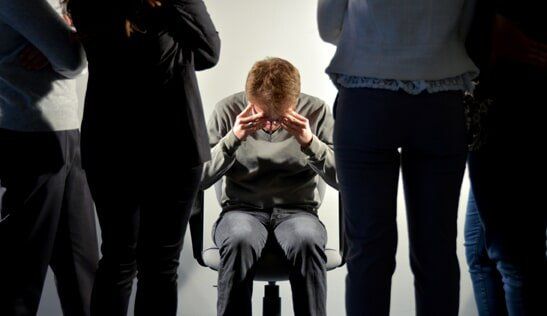 Discrimination  — Man Surrounded By People in Fresno, CA