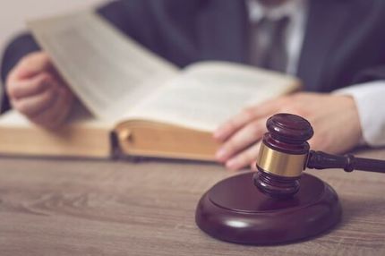 Employment & Labor Attorneys — Lawyer Reading Book of Law in Fresno, CA Employment & Labor Attorneys — Lawyer Reading Book of Law in Fresno, CA