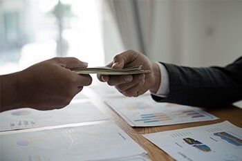 Law Offices of Eric P. Oren, INC. — Men's hands, sending money to a Man in Fresno, CA