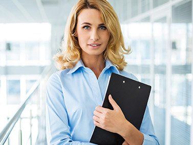 Homeowners Insurance — Beautiful Smiling Businesswoman in Chicago Heights, IL