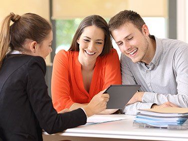 Car Insurance — Business Advisor showing report to Young couple in Chicago Heights, IL