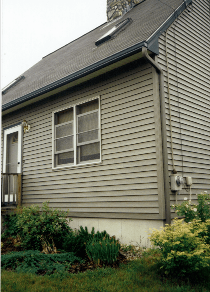 Man Cleaning The Gutter — Raymond, ME — The Gutter People
