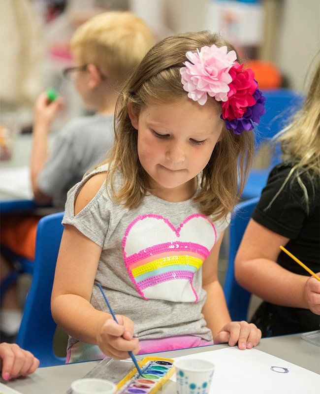 Girl Using Water Color Painting — Mokena, IL — Triple R Child Care