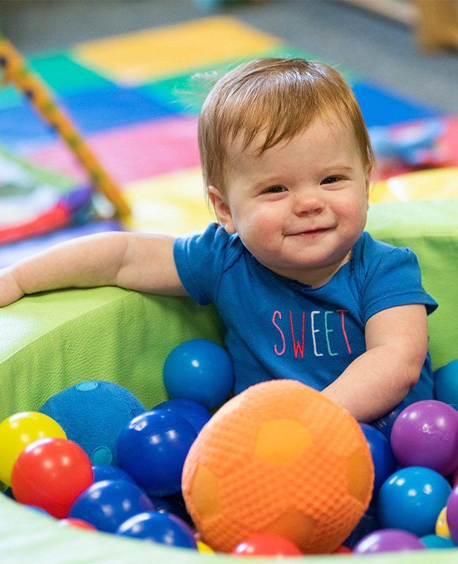 Toddler Playing in a Ball Pool — Mokena, IL — Triple R Child Care Toddler Playing in a Ball Pool — Mokena, IL — Triple R Child Care