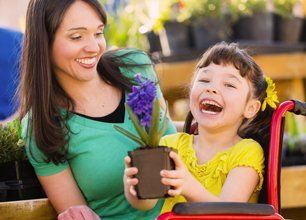A kid laughing with her nanny