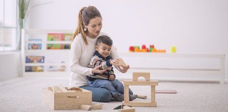 A nanny playing with a child