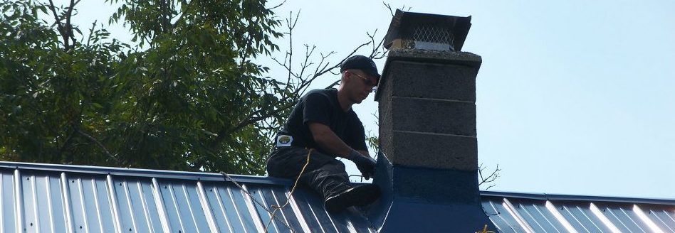 MAN WORKING ON CHIMNEY