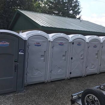 Grey and White Portable Toilets — Delaware, OH — Wells Septic & Drain Cleaning Grey and White Portable Toilets — Delaware, OH — Wells Septic & Drain Cleaning
