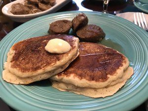 vegan Lemon Ricotta Pancakes on plate with sausage