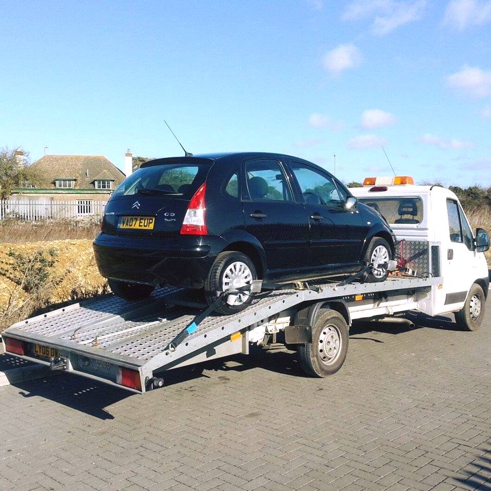Black car on way to be scrapped
