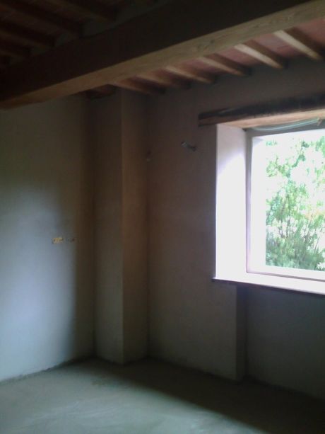 Stanza con travi a vista