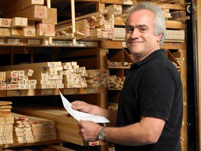 Man Checking Lumber Stack — Building Supplies in Eugene, OR Man Checking Lumber Stack — Building Supplies in Eugene, OR
