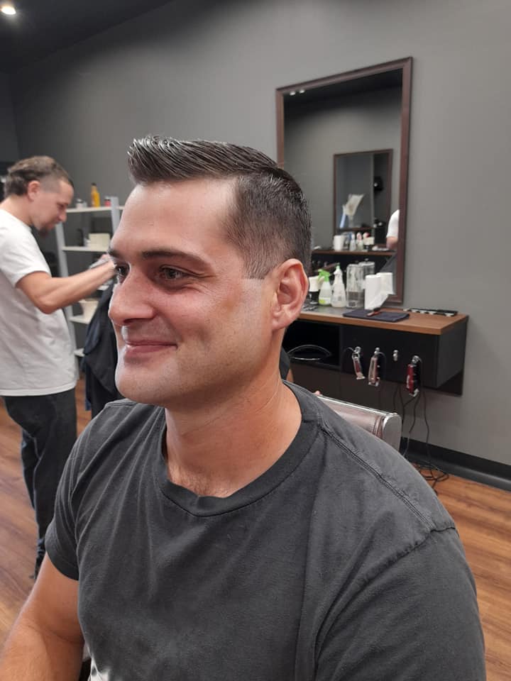 Man Smiling While Getting Haircut — Bolton Brothers Barbers in Erina, NSW