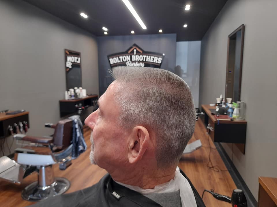 Man With Gray Flat-Top Haircut In Barbershop โ Bolton Brothers Barbers in Erina, NSW