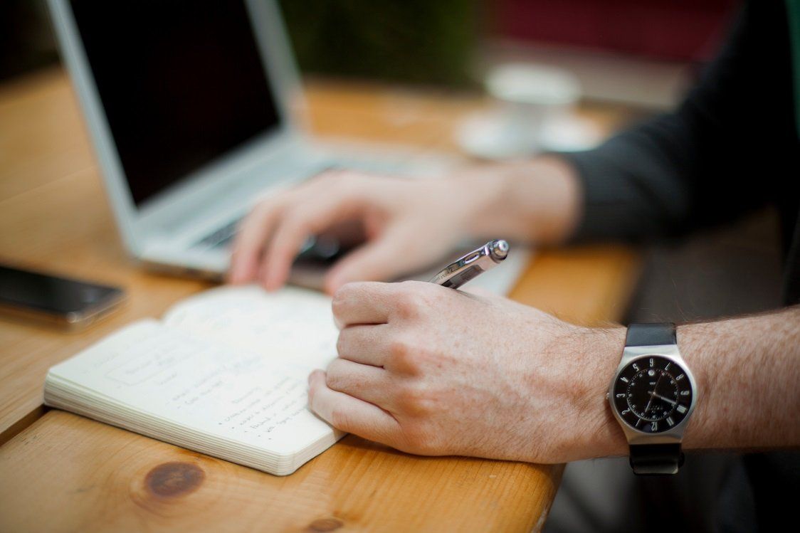 Image of person writing, tips for new managers