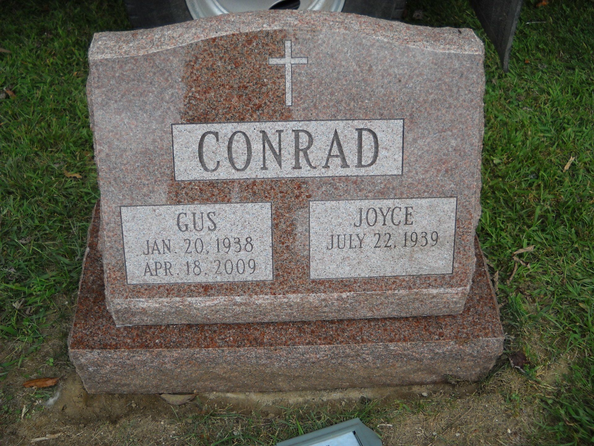 Conrad north american pink single outlined lettering multiple names cross serp top base brp sides deep carved lettering single outlined panel Flat Carved Cross Polished Face