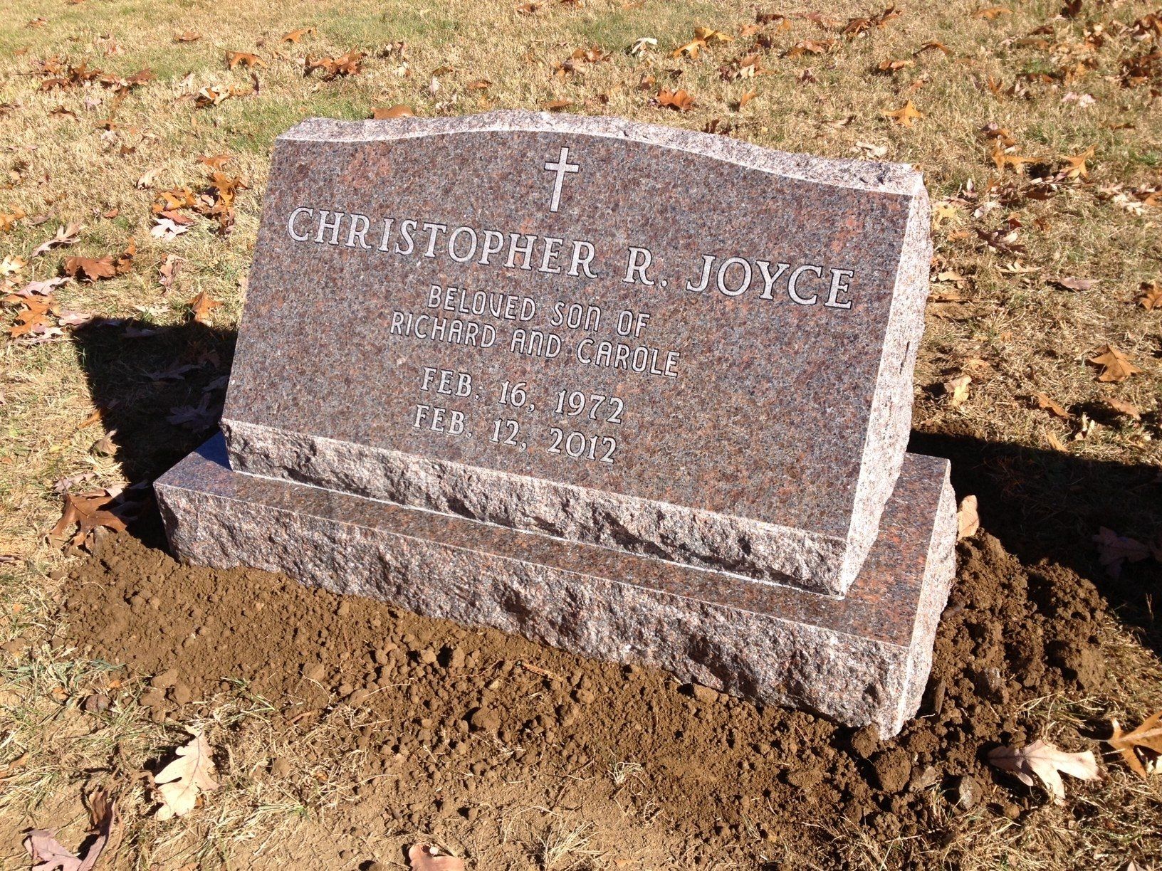 Joyce outlined lettering cross base serp top brp sides Canadian Pink Flat Carved Cross Polished Face