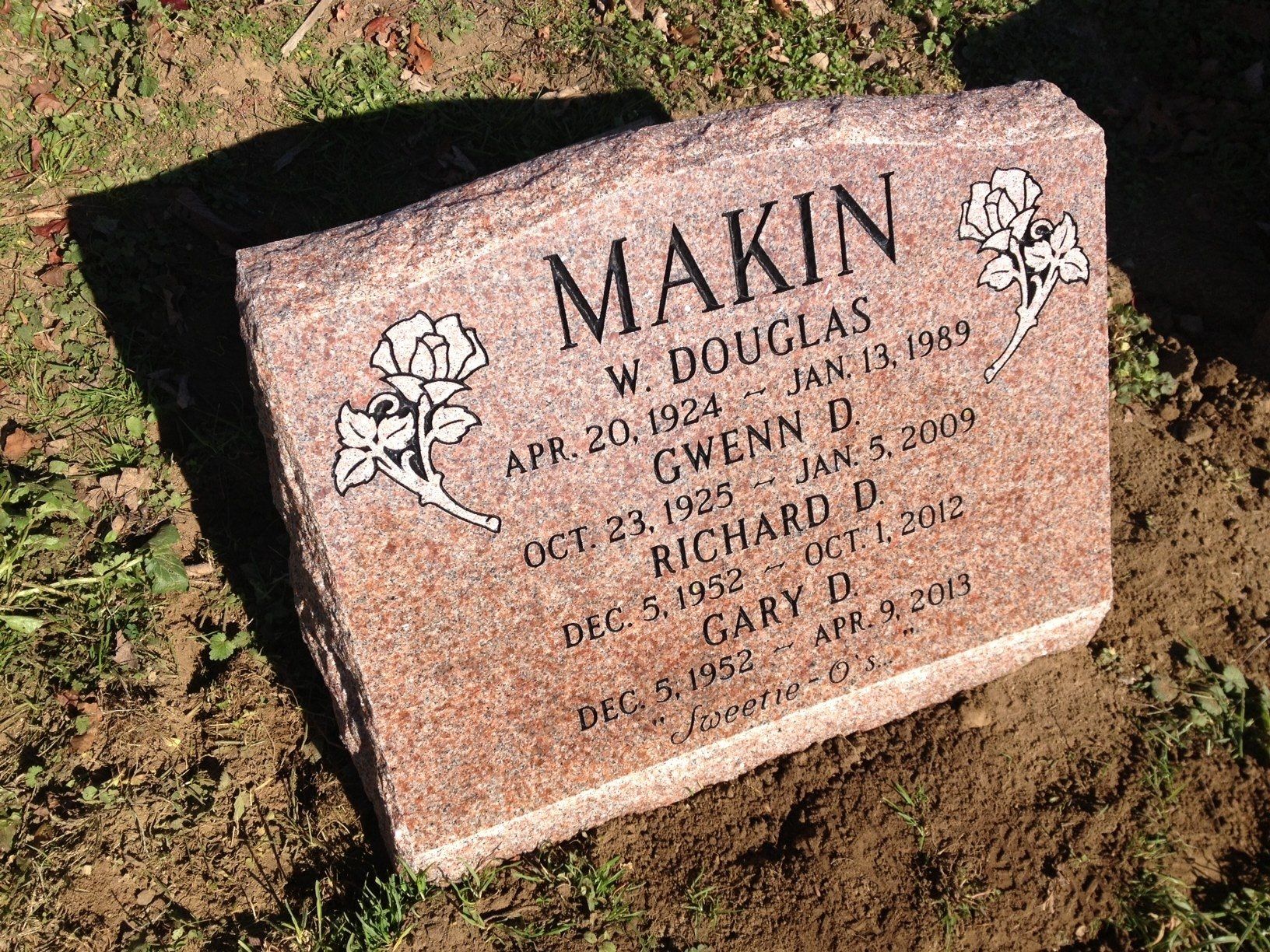 Makin polished face flat carved designs deep carved lettering sprayed in black multiple names serp top floral design brp sides black litho Canadian Pink