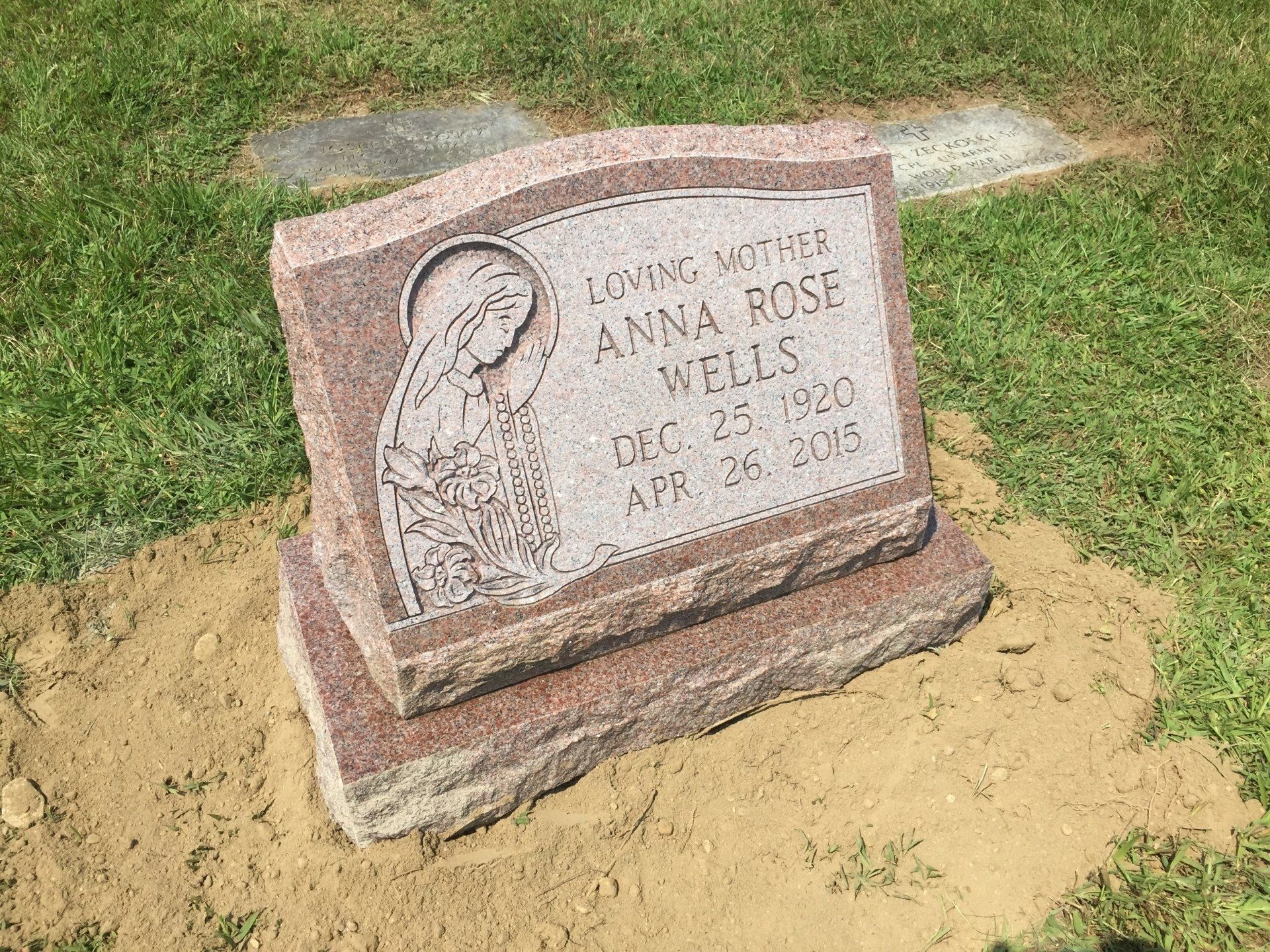 Wells North American Pink Polished Face BRP Sides Serp Top Raised Design Flat Carved Design Deep Carved Lettering Double Outlined Panel Base Shape Carved Florals