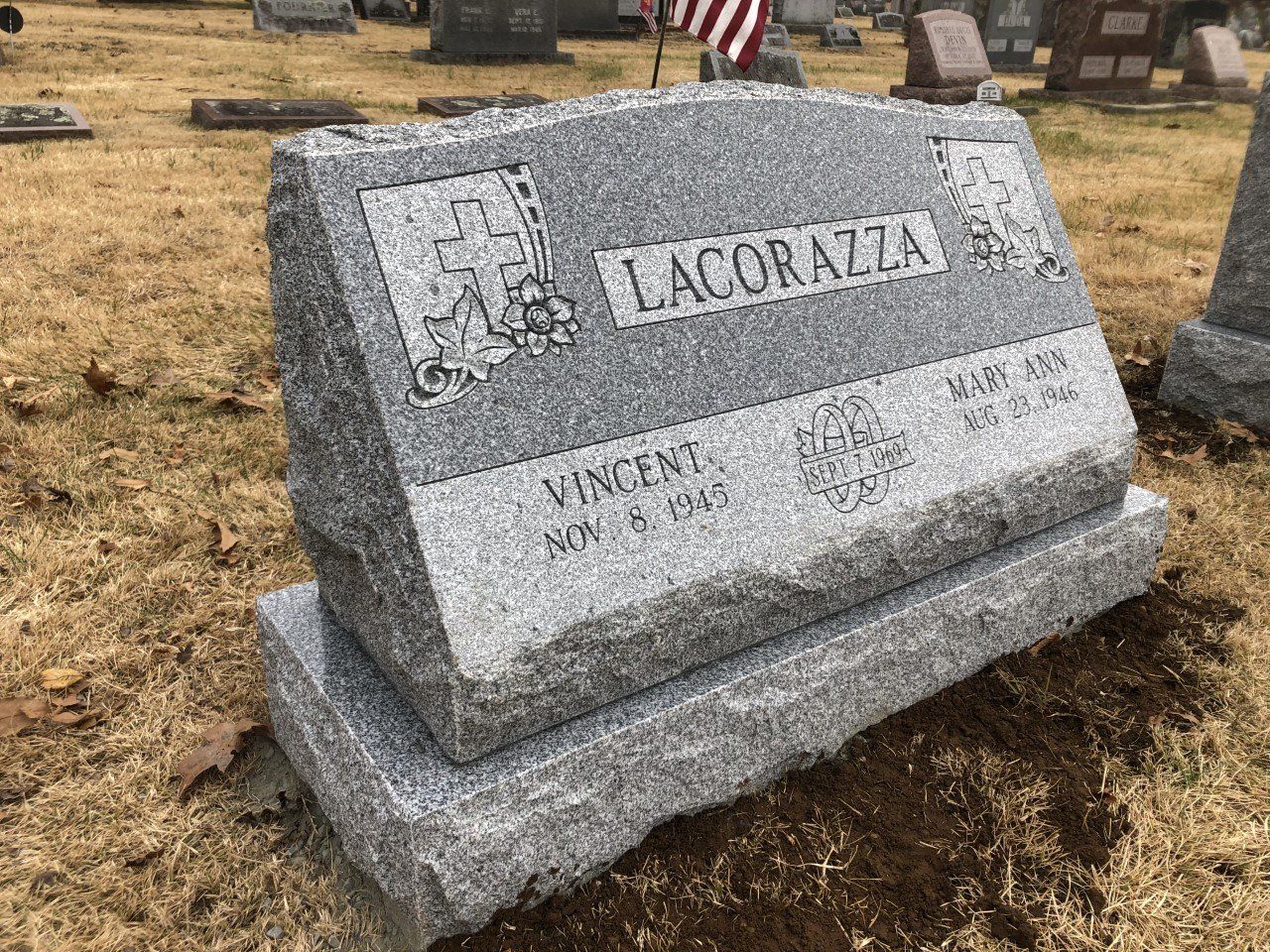 LaCorazza shape carved designs cross floral design multiple names single outlined panel base serp top deep carved lettering brp sides