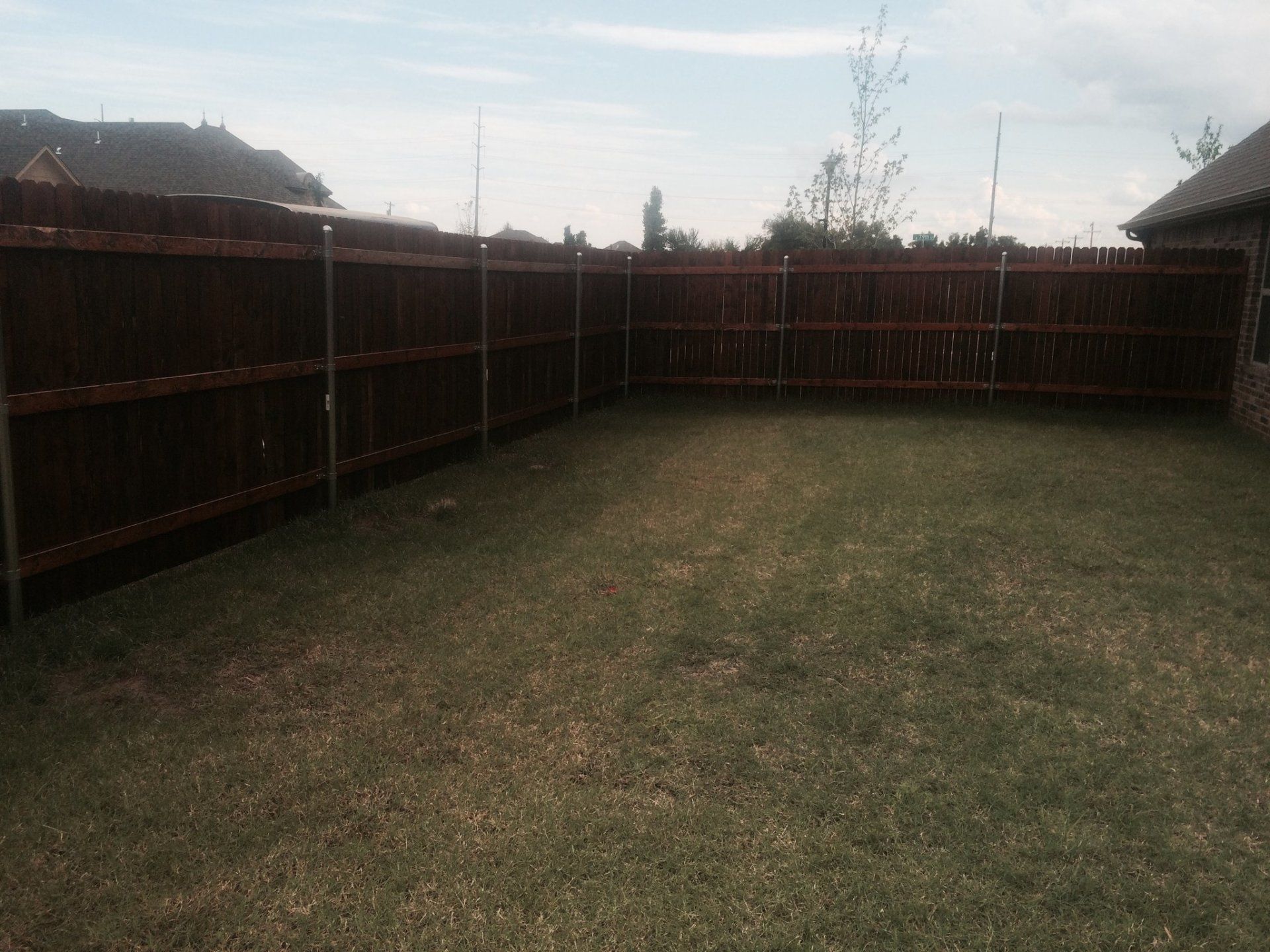 Oxford Brown Excellent Fence — Brown Colored Fence on Barn in Oklahoma City, OK