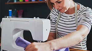 Machine Repair — Woman Using Sewing Machine in Altoona, PA Machine Repair — Woman Using Sewing Machine in Altoona, PA