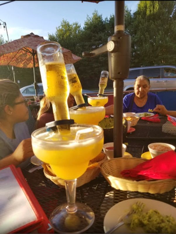 Pouring Corona Drink — Bethpage, NY — Mangoes Mexican Bar & Grill