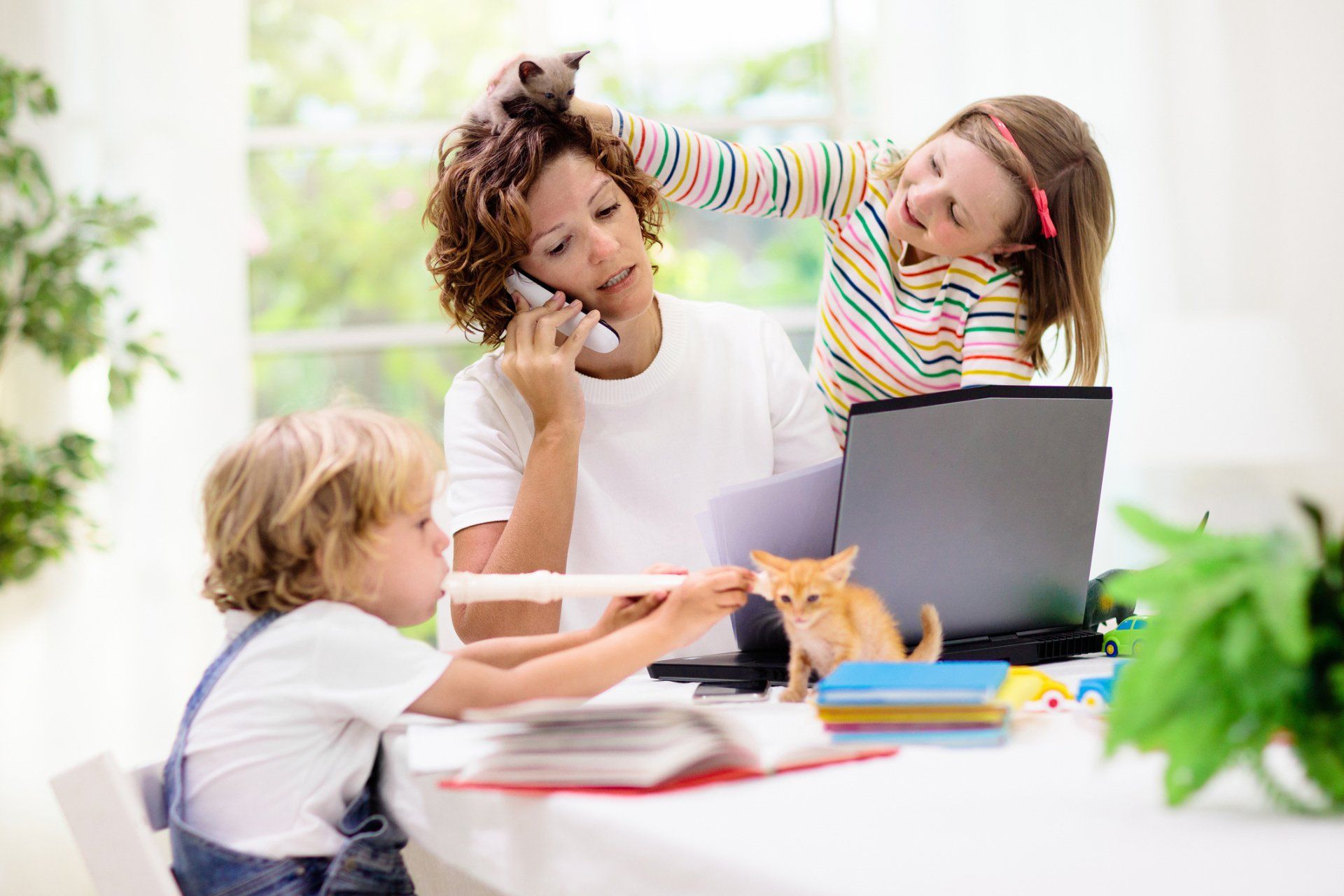 Mother working from home with kids — Denver, CO — Simplified Living Home Services