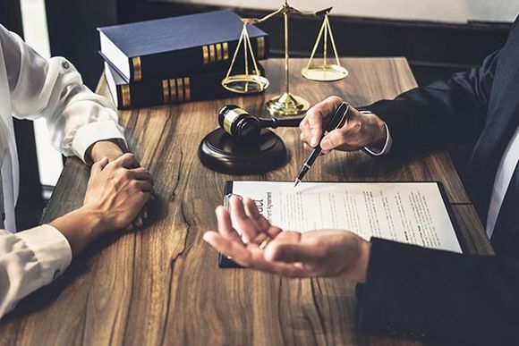 Lawyer with Client — Merrillville, IN — Adedoyin Gomih Law, LLC Lawyer with Client — Merrillville, IN — Adedoyin Gomih Law, LLC