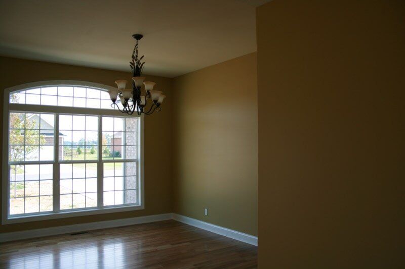 Developments — Empty Living Room with Chandelier in Murray, KY
