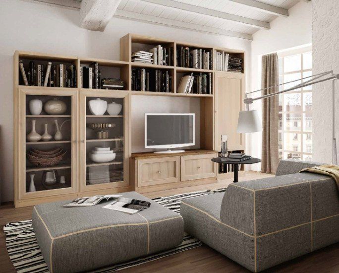 uno studio con una libreria in legno di color nero e due divani di pelle
