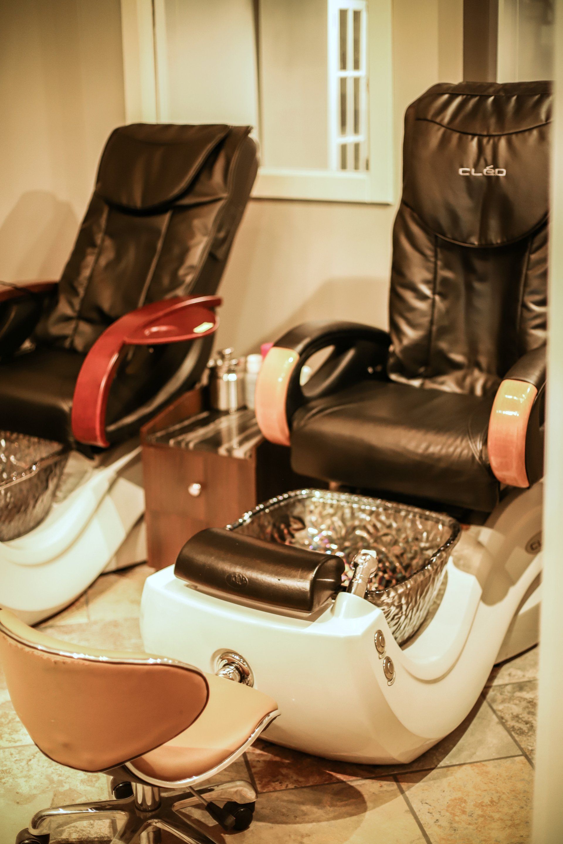 Woman Hands With Colored Nail Polish — Laramie, WY — Luna Salon & Med Spa