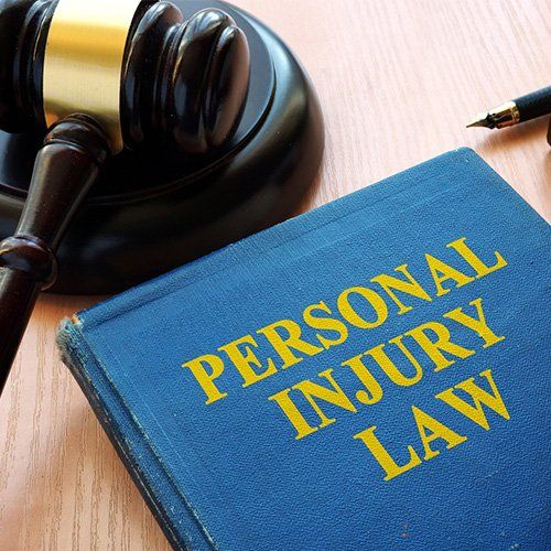 Personal Injury Law Book and Gavel on a Desk — Winter Haven, FL — Straughn & Turner, P.A. Personal Injury Law Book and Gavel on a Desk — Winter Haven, FL — Straughn & Turner, P.A.