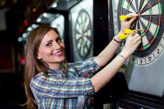 Person playing darts image