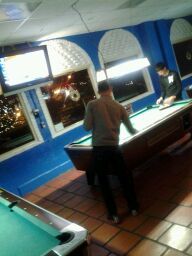 Billiards table with people image
