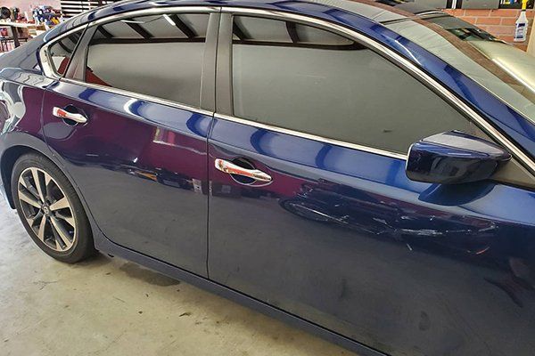 Blue Sedan with Carbon Tinted Windows — Converse, TX — Quality Master Auto Glass Blue Sedan with Carbon Tinted Windows — Converse, TX — Quality Master Auto Glass