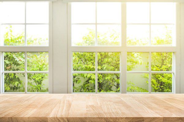 Top of Wood Table Counter on Blur Window — Converse, TX — Quality Master Auto Glass