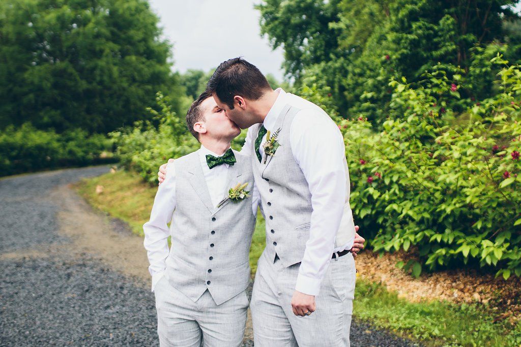Grooms kissing