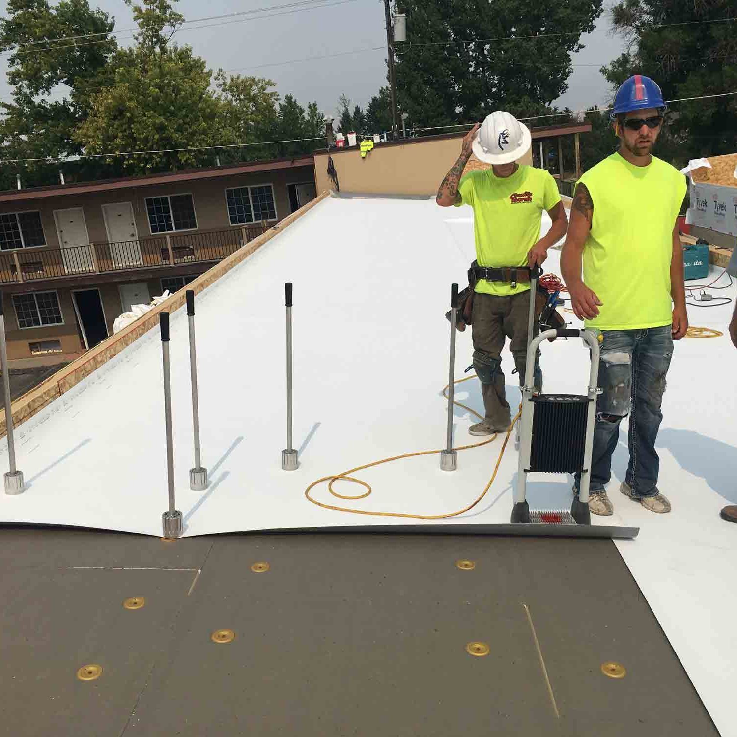Men Working On Roof — Bozeman, MT — Quality Roofing & Sheet Metal