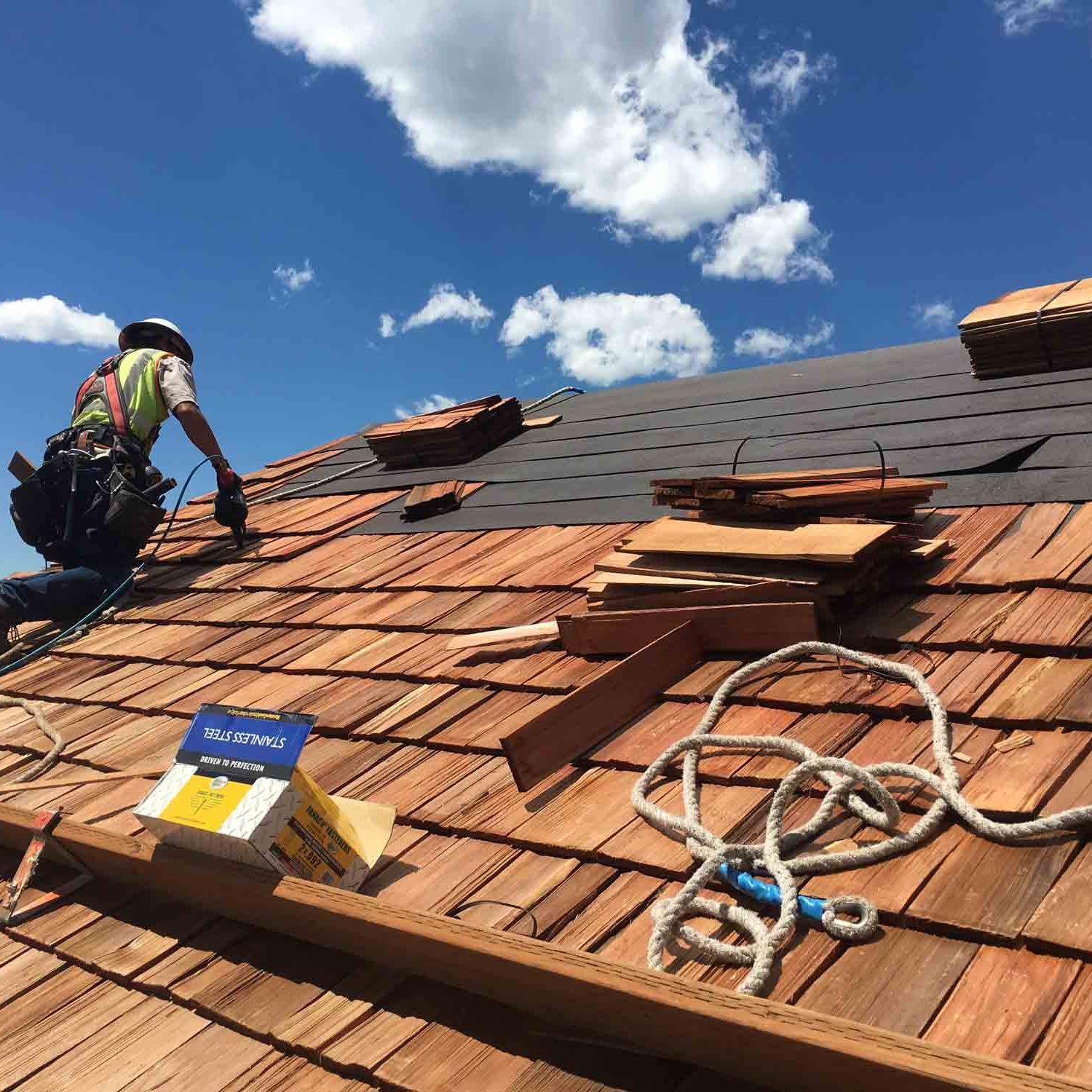 Man Replacing Roof — Bozeman, MT — Quality Roofing & Sheet Metal