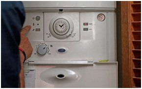 A man wokring on a boiler