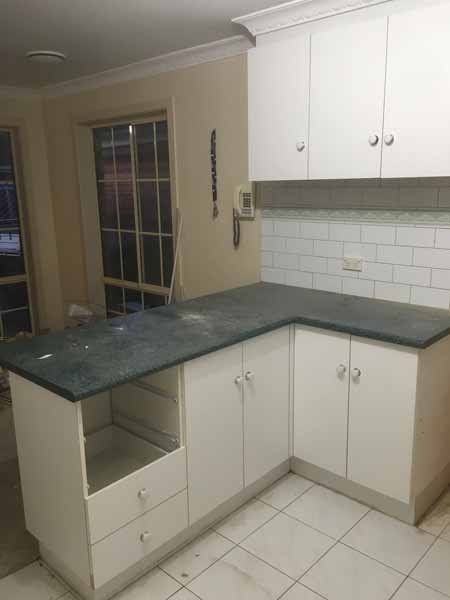 before kitchen with dark counter tops