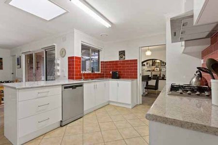 kitchen with red backsplash