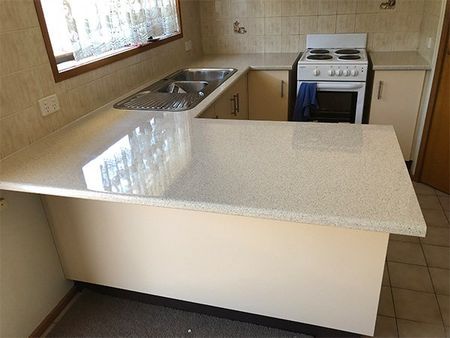 before kitchen with dark counter tops