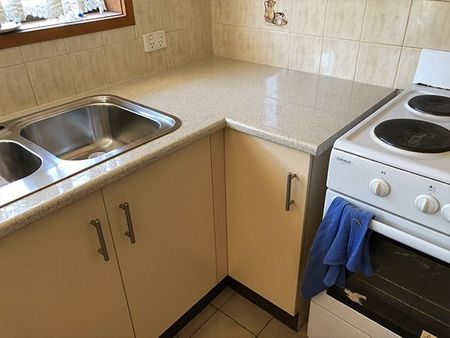 after kitchen with dark counter tops