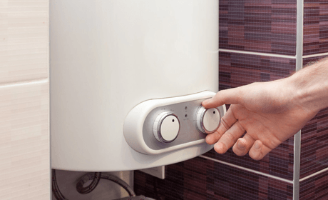 a person checking boiler pressure to repair it