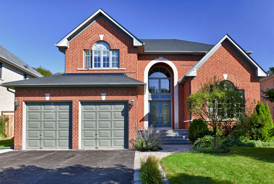2 green garage doors