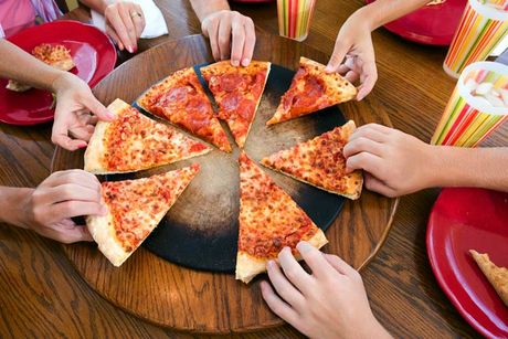 Hands taking slices of pizza - Pizza Restaurant in Philadelphia, PA Hands taking slices of pizza - Pizza Restaurant in Philadelphia, PA