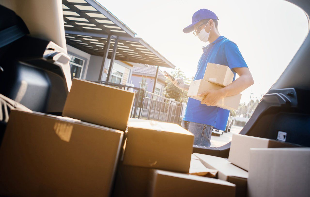 Delivery Man Wearing Mask — Louisville, KY — Montgomery Realtors