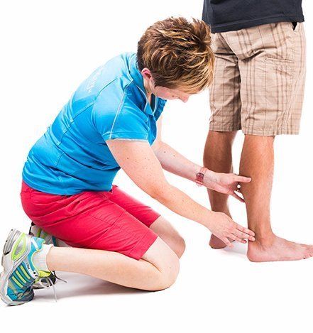 Podiatric doctor accessing the medical condition of the patient foot